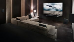 Klipsch-Cinema-1200-Sound-Bar-and-Surround-Sound-System-in-a-dedicated-home-theater-setting-desktop